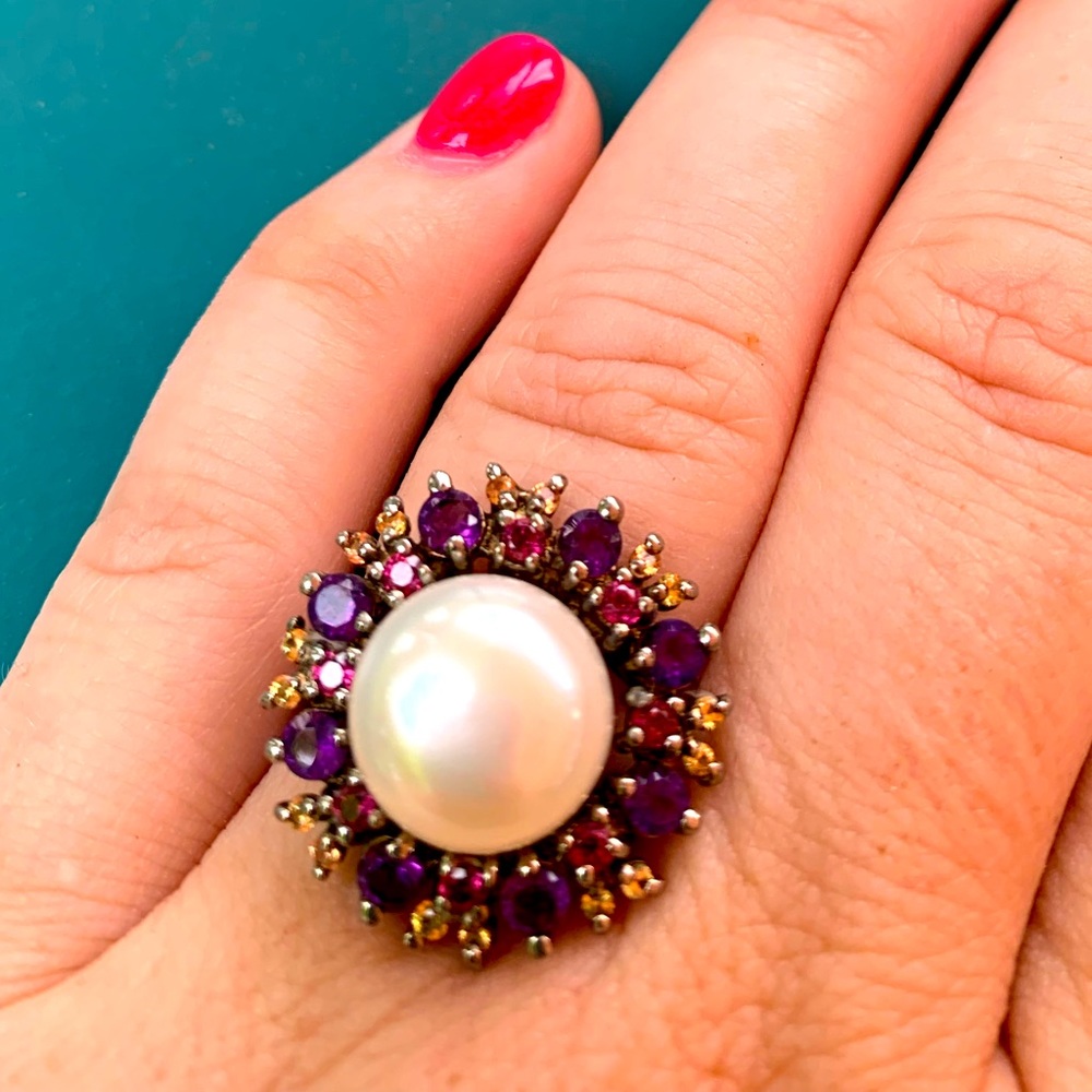 Sterling silver pearl ring surrounded by amethyst and sapphires